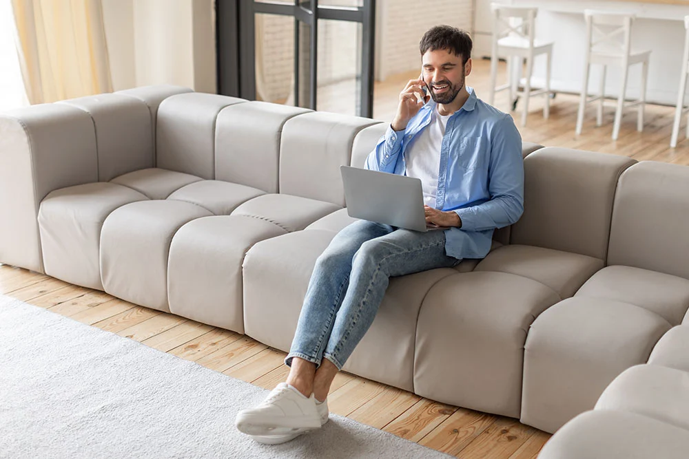 Man working on his laptop from home.